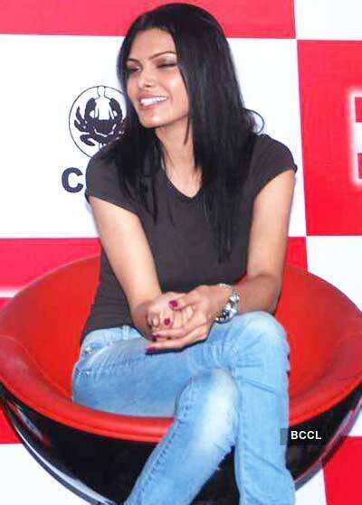 Arjun Rampal and Neetu Chandra cut a cake during the Women's Day ...