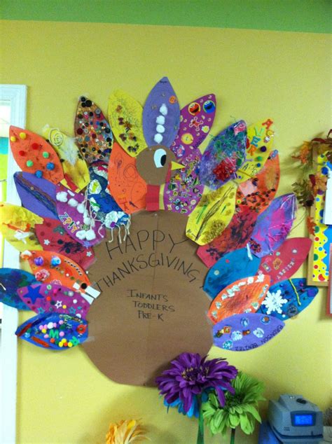 We send home a "feather" with each family to decorate. Then we create ...