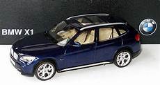 bmw x1 1 43 bmw x1 e84 deepseablue met werbemodell schuco bmw x1 1 43 bmw x1 e84 deepseablue met werbemodell schuco