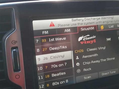 What does battery discharge warning mean on Kia Sportage?