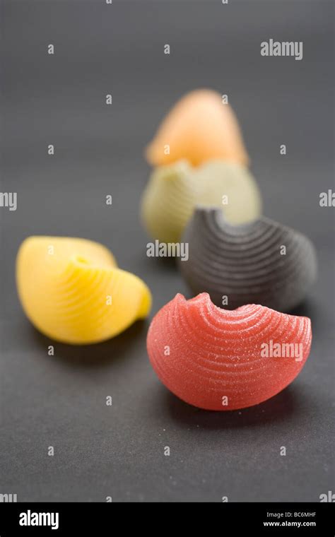 Coloured lumaconi (pasta shells Stock Photo - Alamy
