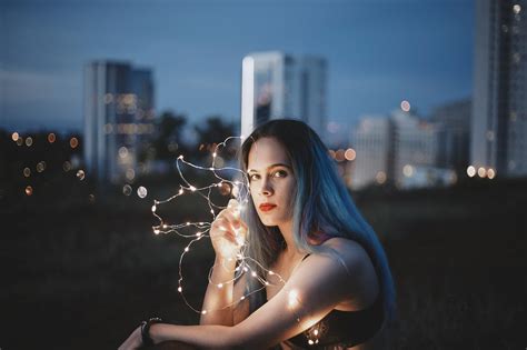 Woman Holding String Lights · Free Stock Photo