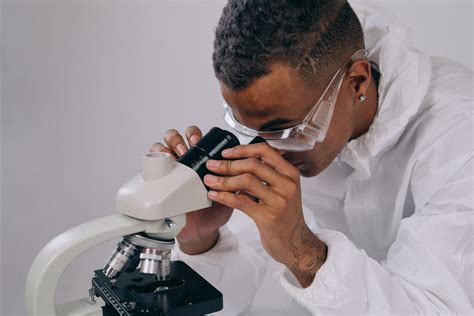 Image result for A Person Inspecting Using Microscope