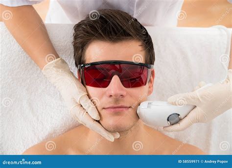 Beautician Giving Laser Epilation Treatment To Man Face Stock Image - Image of beautician ...