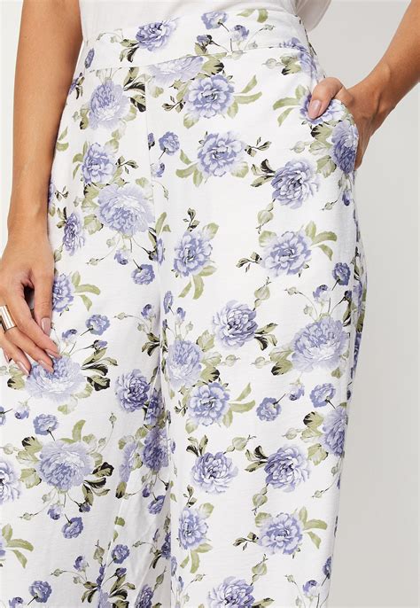 Buy Women Floral Printed Wide Leg Trousers Online at just Rs. 999.0 ...