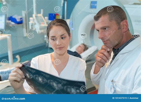 Radiology Specialist Inspecting Result Stock Image - Image of health, radiography: 101437519