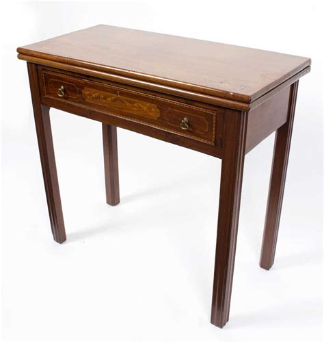 Lot 660 - An Edwardian mahogany rectangular card table,