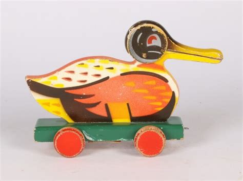 Ole Kirk Christiansen for LEGO. And painted wood on wheels with 'rap ...
