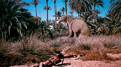 "Mom" carries of Sanna the Cave girl in WHEN DINOSAURS RULED THE EARTH ...