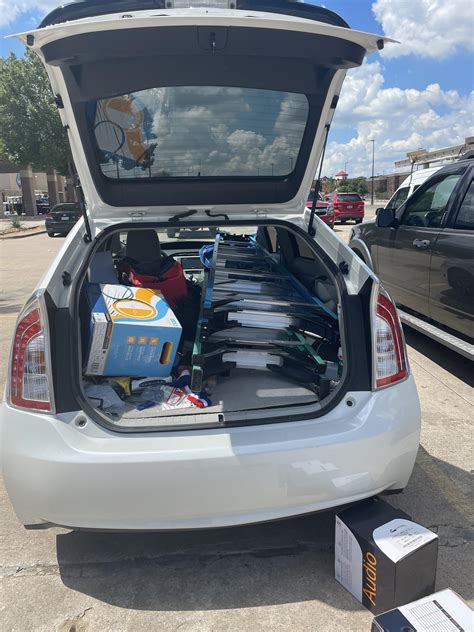 6 foot and 8 foot ladder fits with tons of room to spare. : prius