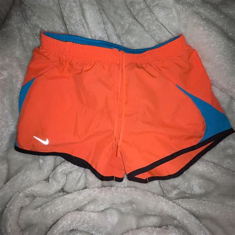 Orange Nike shorts lightly worn - Depop