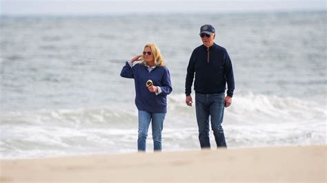 President Joe Biden and First Lady Jill Biden walk on Rehoboth Beach
