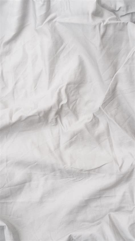 White Bed Sheets and Pillows