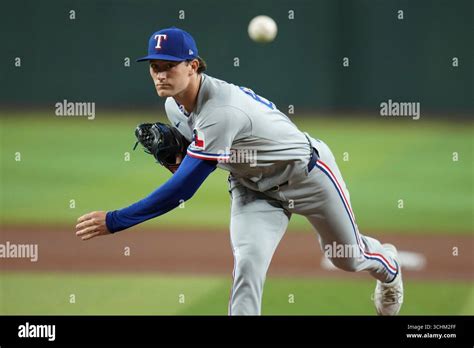 Texas Rangers starting pitcher Jacob Latz warms up during the first ...