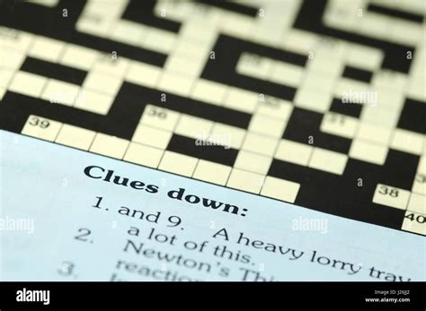 crossword puzzle closeup with clues down Stock Photo - Alamy
