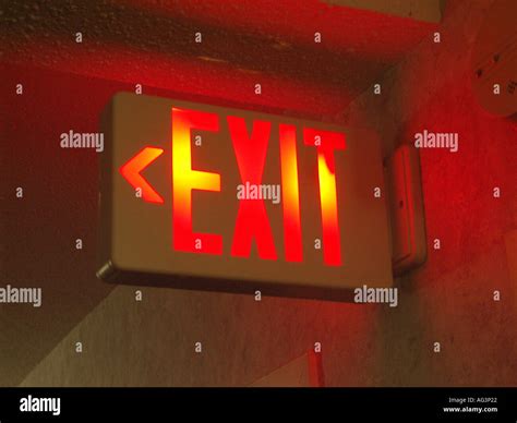 Red lit exit sign hi-res stock photography and images - Alamy