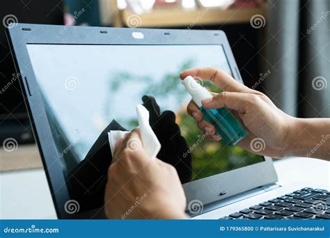 Woman Hands Cleaning Laptop Screen with Disinfectant Wet Wipe. Concept ...