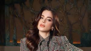 Miss Universe Fatima Bosch falls on a parade float at Ecuador festival