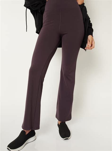 Buy Women Solid Flared Track Pants Online at just Rs. 999.0 ...