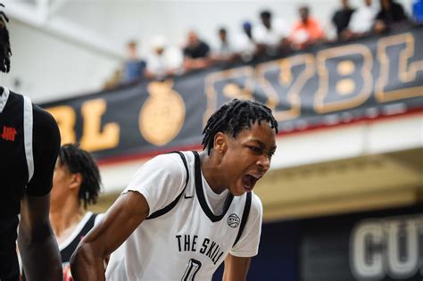 Duke basketball recruit poses with Coach K during official visit