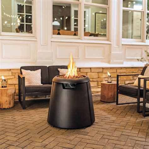 TIKI's Innovative Propane Fire Pit Can Also Convert into a Patio Heater ...