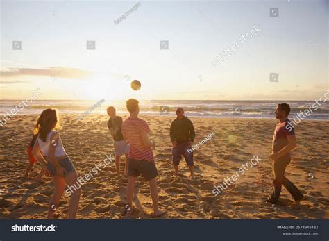 Group People Playing Volleyball On Beach Stock Photo 2574948483 ...