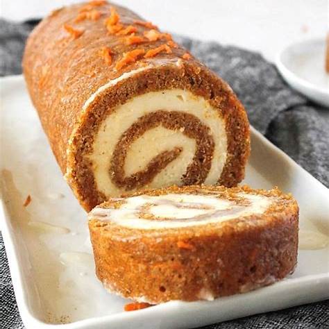 https://100krecipes.com/wp-content/uploads/2020/10/Carrot-Cake-Roll-with-Cream-Cheese-Frosting-FillingFirst-image-2.jpg
