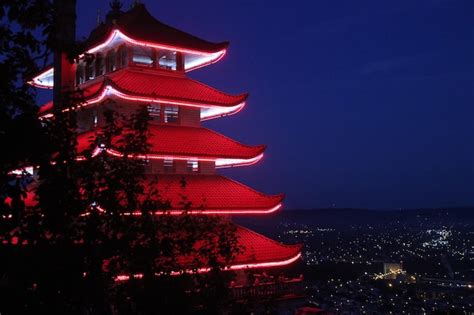 Temple at night illuminated with light from decorations