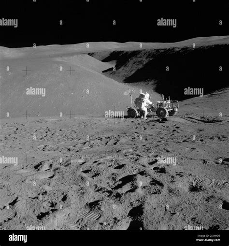 Astronaut David Scott working with the Lonar Rover in Hadley Rille, the ...