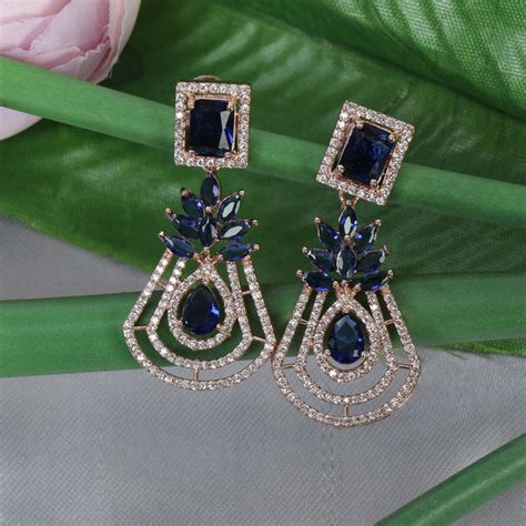 Handcrafted rose gold plated blue dangler american diamond earrings ...