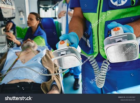 Paramedic Preparing Defibrillator Cardiopulmonary Resuscitation ...