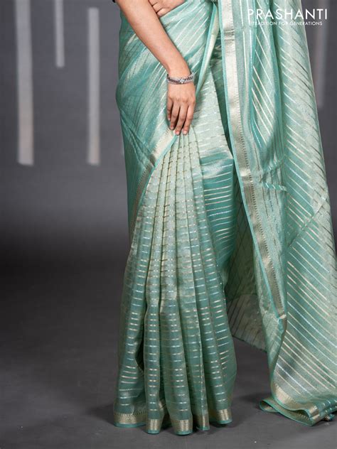 Tissue silk saree teal shade with allover silver & zari weaves and zar ...