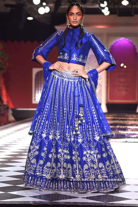 A model showcases designer Anita Dongre’s creation during FDCI India ...