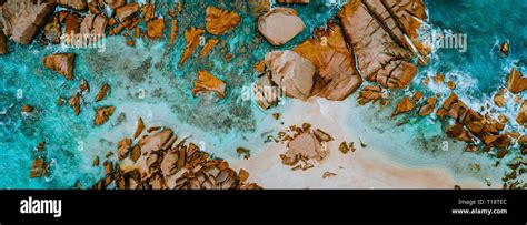 Aerial shots of the turquoise water, reef formations, beach and shipwreck at Henrietta Rocks.