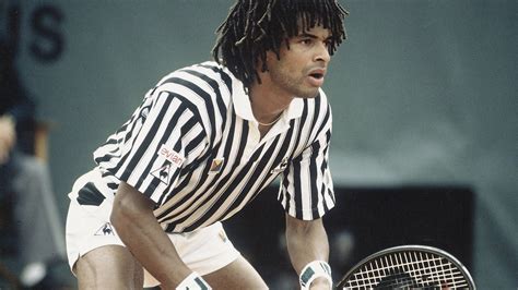 Download Caption: Young Yannick Noah in action during a tennis match ...