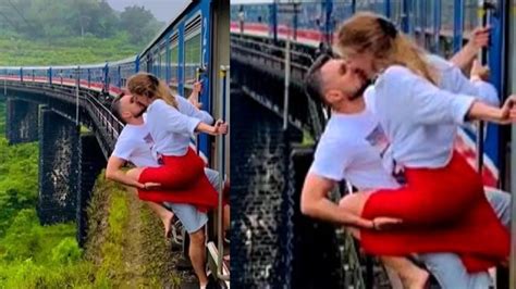 Couple kiss video| Viral: Couple dangerously locks lip on moving train ...