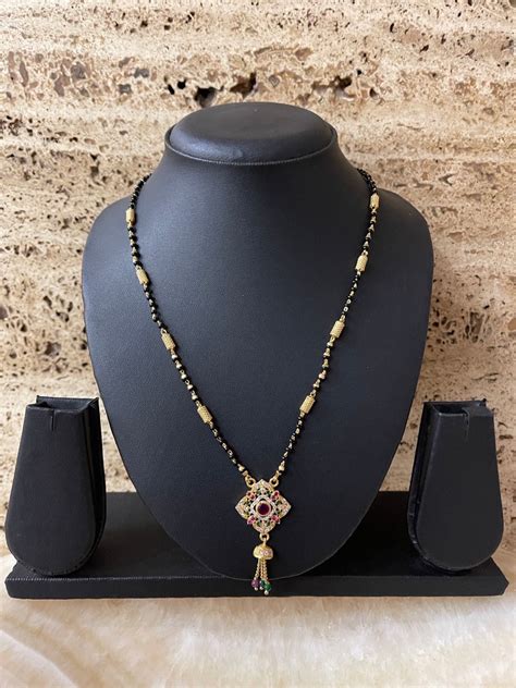 Short Mangalsutra Designs In Gold | American Diamond Mangalsutra | DDR ...