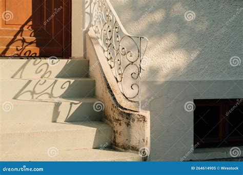 Outdoor Stairs with Wrought Iron Railings in Front of the House Stock ...