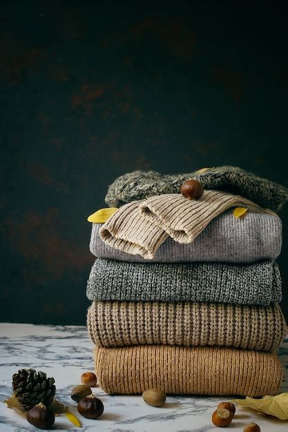 Stack of cozy knitted sweaters. autumn-winter concept, knitted wool ...