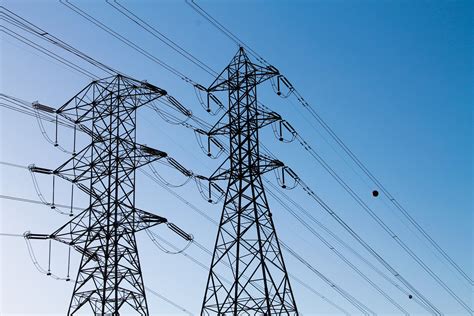 Free Stock Photo of Electric Towers with Power Lines in Blue Sky