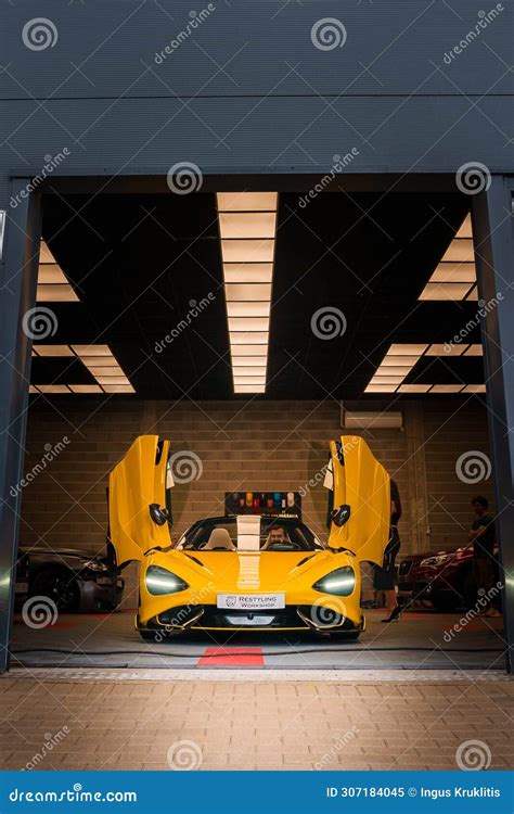 Yellow McLaren 765LT, Open Doors, Showcased in a Chic Tuning Garage Editorial Image - Image of ...