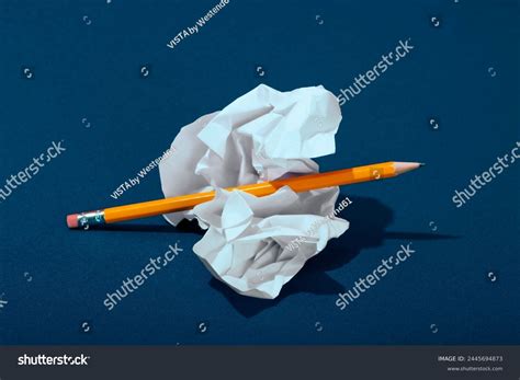 Crumpled Paper Pencil On Blue Background Stock Photo 2445694873 | Shutterstock