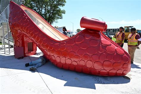 Liberal unveils giant ruby red slipper slide