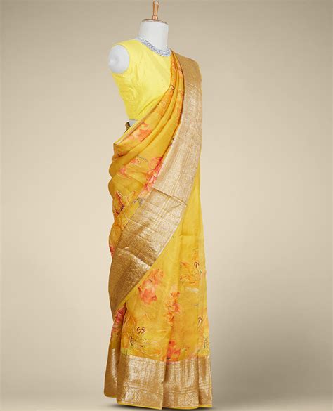 Light mustard yellow floral printed & embroidered organza saree, self-