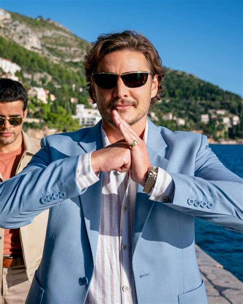 Download Pedro_ Pascal_ Stylish_ Oceanside_ Pose Wallpaper | Wallpapers.com