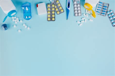Pills scattered out the bottles and blisters | Premium Photo