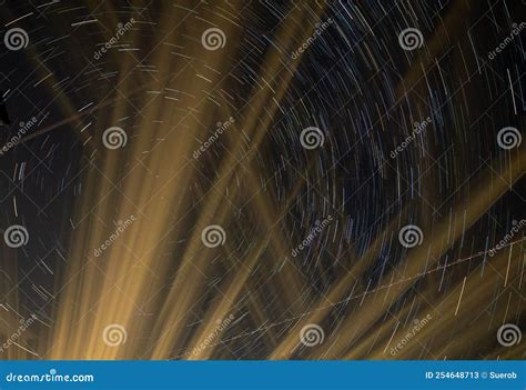 Star Trails with Plane Trails and Light Beams Stock Image - Image of ...