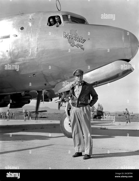 General Douglas MacArthur posing in front of his C-54 Skymaster plane ...