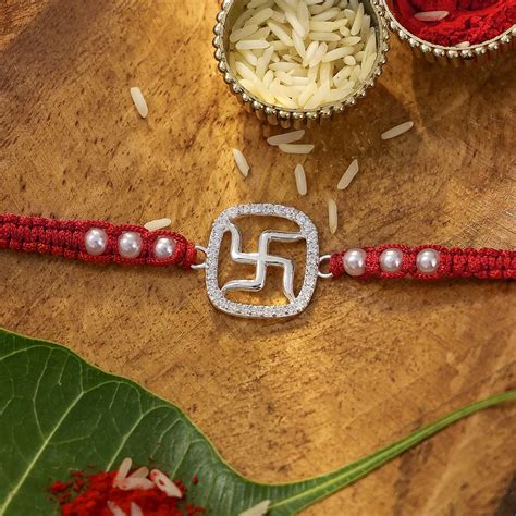 Pure Silver Rakhi - Stone Swastik in Red Beaded Thread