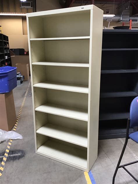 13 1/2x34 1/2x78” Beige metal bookcase 7/8/25 - ND Surplus
